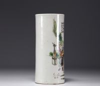 China - A polychrome porcelain brush-holder decorated with characters and a poem, circa 1900.