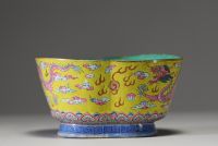 China - A pink family polychrome porcelain bowl decorated with an Imperial dragon on a yellow background, Tao Kuang mark and period.
