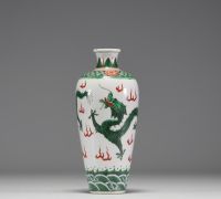 China - A 19th century green family polychrome porcelain vase decorated with a dragon.
