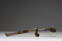 Malaysia - Kriss, horn handle, wooden and silver scabbard, hammered steel blade, 19th century.