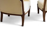 Louis MAJORELLE (1859-1926) Pair of Art Nouveau armchairs in moulded mahogany with fruit and flower motifs.