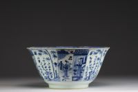 China - Large blue-white porcelain bowl with floral decoration and figures, Kangxi.