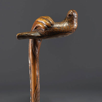 Art Populaire - Carved wooden cane with a hand holding a bird, fully carved shaft.