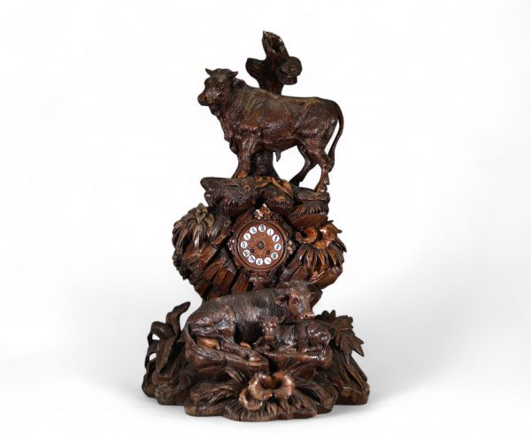 Switzerland, 19th century - Black Forest clock in carved wood