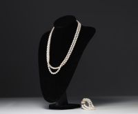 Two strands of cultured pearls, necklace and bracelet, 18k gold clasps.