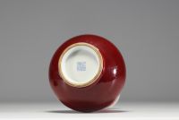 China - Oxblood porcelain vase, wooden base, 19th century.