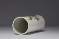 China - A polychrome porcelain brush-holder decorated with characters and a poem, circa 1900.