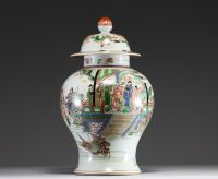 China - Covered vase in green family polychrome porcelain decorated with characters, circle mark under the piece.