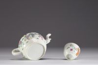 China - A famille rose porcelain teapot and bowl decorated with figures, 19th century.