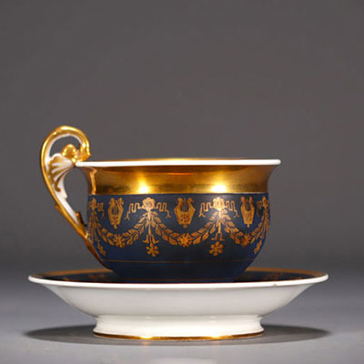 Blue and gold porcelain chocolate cup and saucer, Empire, 19th century.