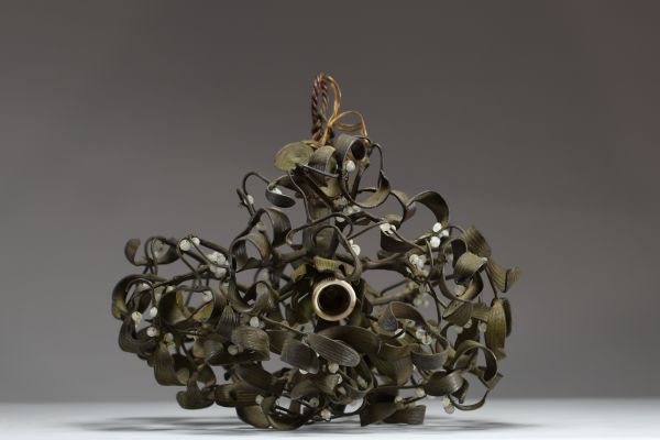 A three-light bronze chandelier with a green patina and opaline glass, representing a mistletoe ball, circa 1900.