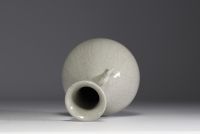 China - Monochrome porcelain vase on wooden base, blue mark under the piece.
