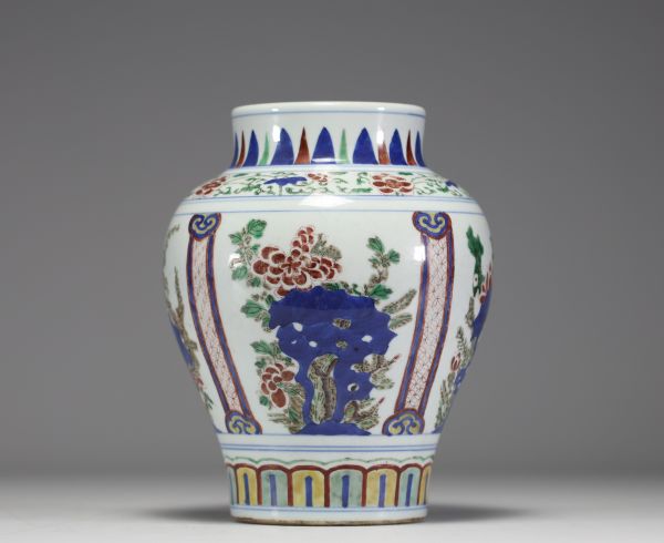 China - A 19th century polychrome porcelain vase with floral decoration.