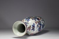 China - Large polychrome porcelain vase richly decorated with figures and furniture, 19th century.