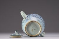 China - A white-blue porcelain teapot with floral decoration, late Ming period.
