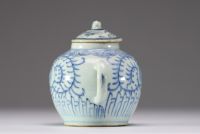 China - A white-blue porcelain teapot with floral decoration, late Ming period.