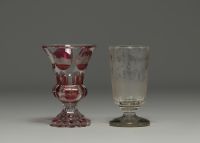 Bohemia - Pair of engraved glasses, one with a deer design and one in multi-layered glass with a city design.