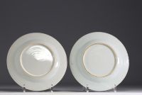 Set of eight plates in pink family polychrome porcelain, 18th century.