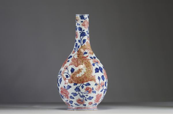 China - Polychrome porcelain vase decorated with a dragon, a phoenix and copper-red peony flowers, Qianlong period.