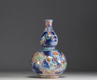 Chine - Vase double gourdes à décor de paysages montagneux et personnages.