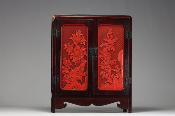 China - Hardwood cabinet inlaid with cinnabar panels, 19th century.