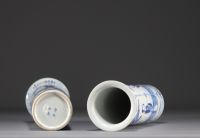 China - Pair of blue-white porcelain vases decorated with ladies and bats, Kanjxi mark, 19th century.