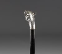 Art Deco silver cane with lioness head decoration and glass eyes.