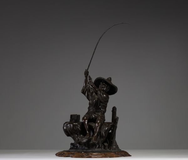 Japan - ‘The fisherman’ Bronze sculpture with brown patina, monogrammed on the back, late 19th century.