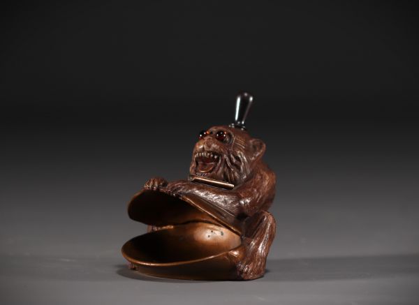 Bronze monkey with wick lighter, sulphide eyes, circa 1900.