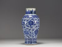 China - A transitional-period blue-white porcelain vase decorated with flowers.