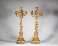 Très belle paire de candélabres à cinq feux en bronze doré et patiné à décor de faune et faunesse, XIXème.