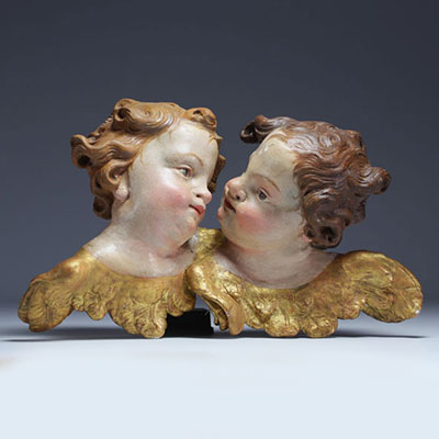 ‘Two heads of cherubs’ Polychrome wood carving, 18th century.