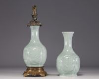China - A celadon porcelain oil lamp and shaft decorated with flowers and bamboos, 18th-19th century.