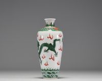 China - A 19th century green family polychrome porcelain vase decorated with a dragon.