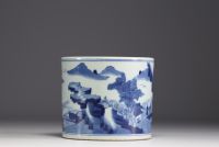 China - A white and blue porcelain brush with landscape decoration.