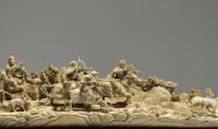 China - Ivory group carved in a tusk, depicting a hunt, silver-veined wooden base, circa 1920-30