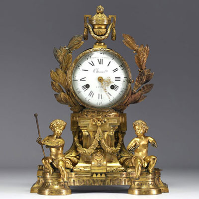 An ormolu and chased clock, allegory of the arts with Putti, dial signed Cherier in Paris, Louis XVI period.