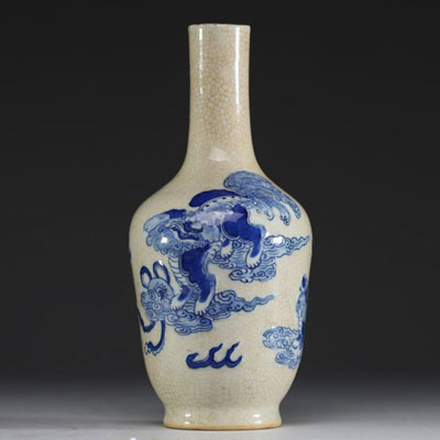 China - A 19th century Nanking porcelain vase decorated with Fô dogs on a crackled background.
