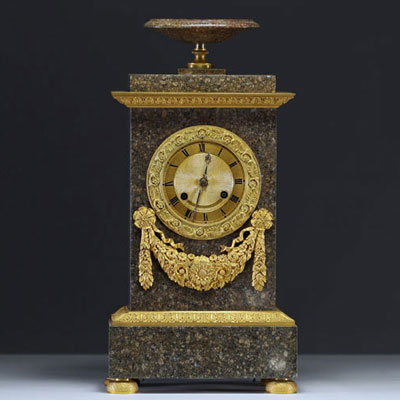 An Empire period porphyry and gilt bronze mercury clock.