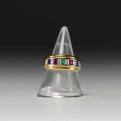 Ring set with diamonds, sapphire, rubies and emeralds in 18k gold weighing 5.2gr.