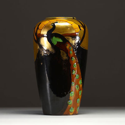 Art Nouveau porcelain vase decorated with a peacock.
