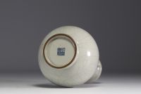 China - Monochrome porcelain vase on wooden base, blue mark under the piece.