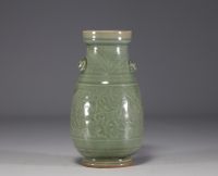 China - Celadon monochrome porcelain vase with floral design in relief.