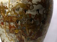Japan - Imposing Satsuma covered vase decorated with dignitaries, magicians and courtesans, Meiji period.