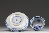 China - Bowl and plate in white-blue porcelain with floral decoration, mark under the piece, 17th century.