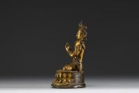 China - Tibet - A 17th century ormolu figure of Shadakshari Lokeshvara.
