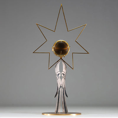 Art Deco monstrance with hallmark 800 on the bezel and another crowned hallmark on the base, inlaid with green stones.