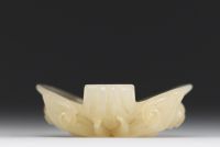 China - Taotie mask in carved green jade.