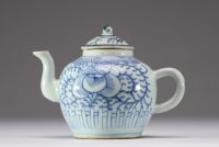 China - A white-blue porcelain teapot with floral decoration, late Ming period.