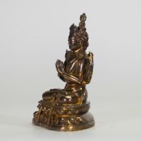 CHINE,  XIXe Figure d’Avalokiteśvara à quatre bras en bronze doré.